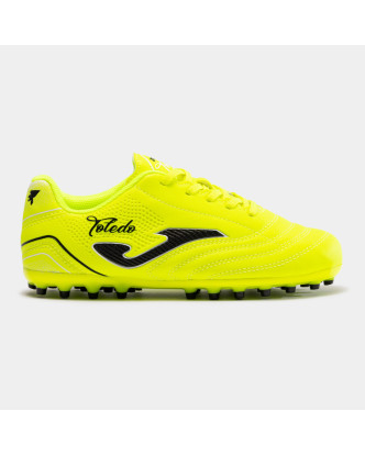 BOTA FUTBOL JOMA TOLEDO JR 2404 LEMON FLUOR ARTIFICIAL GRASS